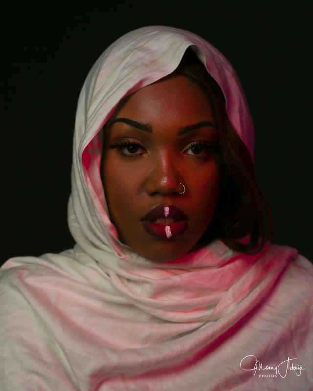 Studio-style portrait photograph — Detroit photographer Manny Adeniji (89)
